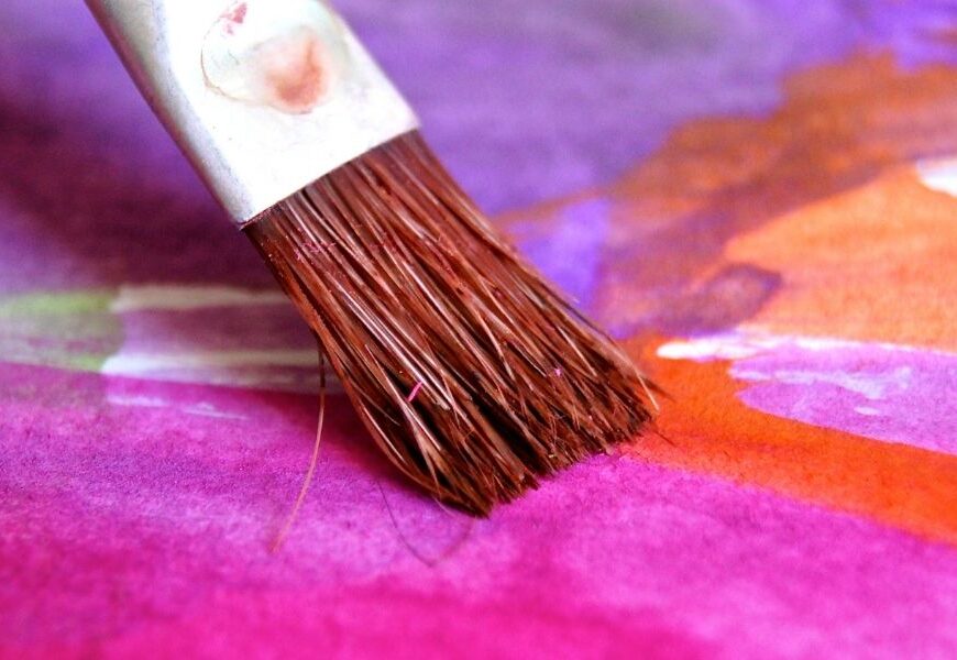 paintbrush with pink paint