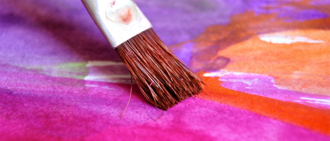 paintbrush with pink paint